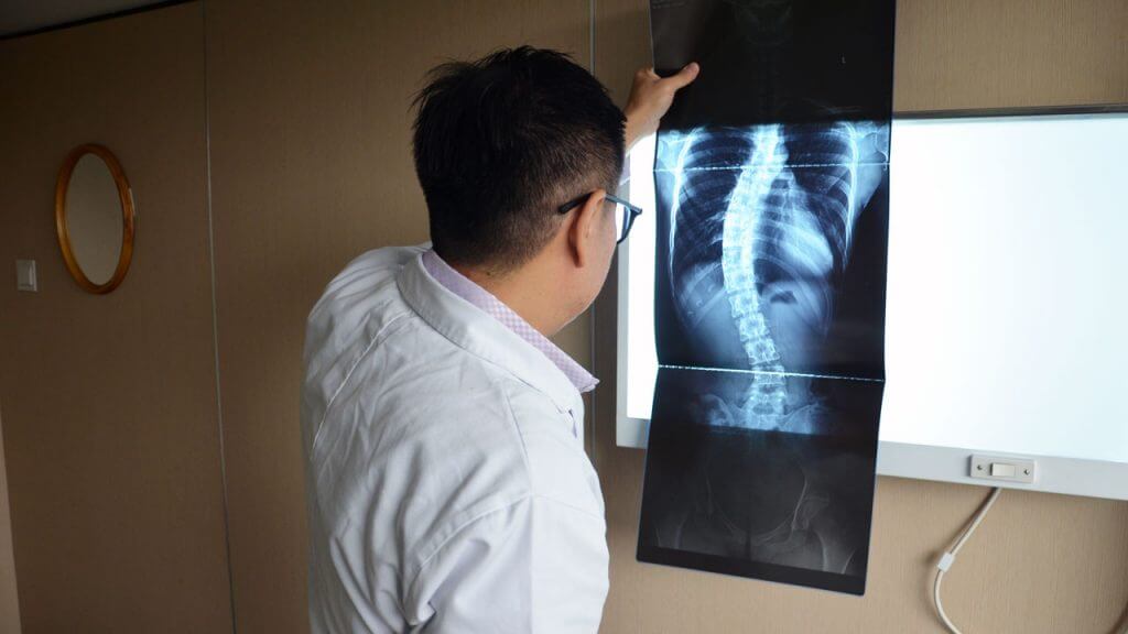 Doctor providing chiropractic care for scoliosis